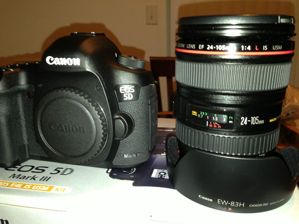 Canon EOS 5D Mark III with the lens and the Galaxy S3 phone